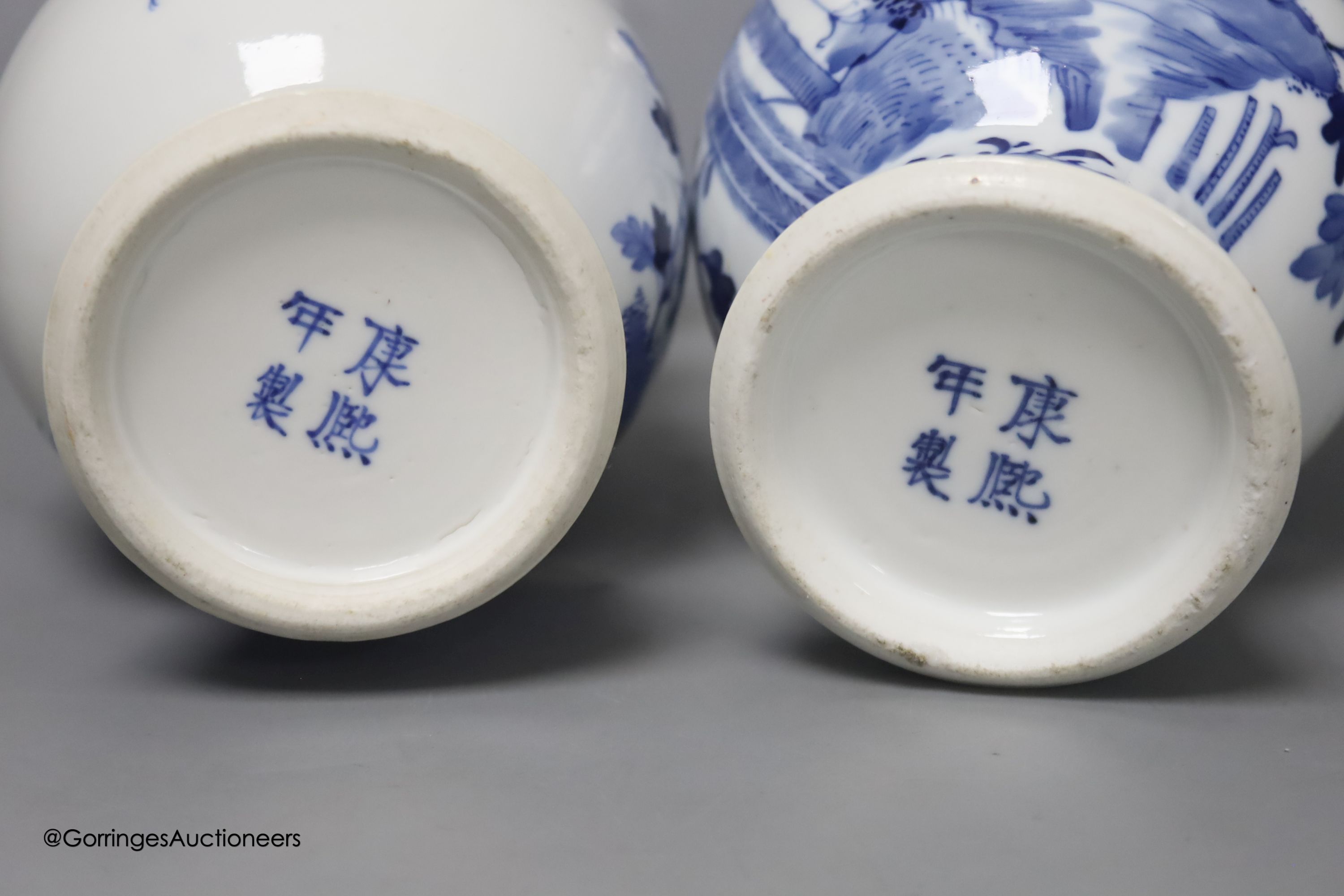 A pair of Chinese blue and white 'phoenix' vases, Kangxi marks but late 19th century, height 20cm (a.f.)
